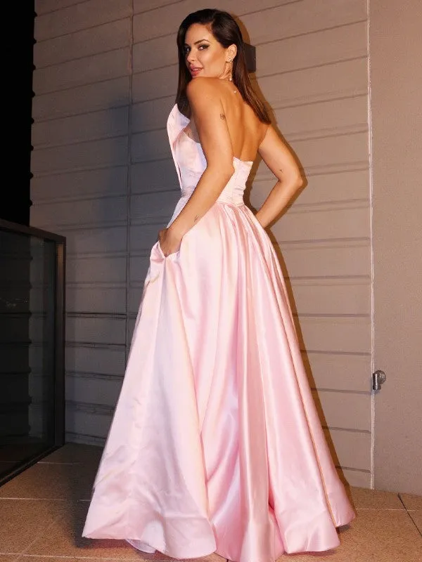 Glamorous Pink Prom Gown with a Flirty Split and Convenient Pockets